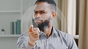 Portrait in office mad angry aggressive bearded African American businessman professional manager employer man office