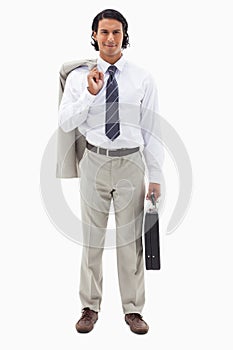 Portrait of an office worker holding his jacket over his shoulder and a briefcase
