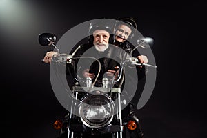 Portrait of old cool man drive chopper motor bike ride his wife enjoy free dome extreme lifestyle adventure wear vintage