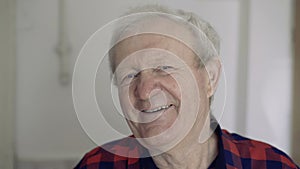 Portrait of old handsome man smiling at camera. 4K