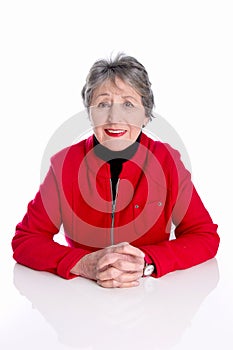 Portrait of old lady with grey hair in red jacket isolated on white background