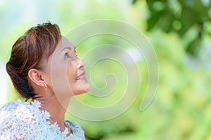 Portrait old lady resting outdoors