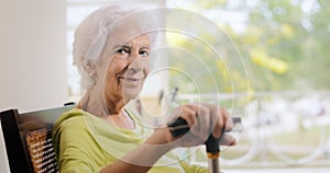 Portrait Old Lady Sitting On Rocking Chair Holding Stick