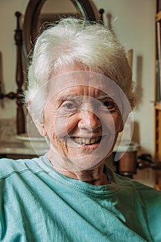 Portrait of old lady with white hair and smile
