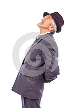 Portrait of an old man with back pain