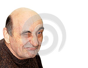 Old man with a grimace on his face photo