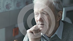Portrait of old man looking at camera 4K