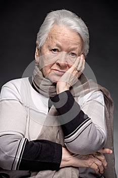 Portrait of old pensive woman