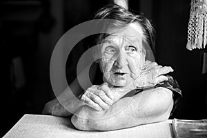 Portrait of old woman. Black and white photo.