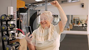 Portrait old woman in gym. Physical culture for older people. Training and individual courses. Happy people smile