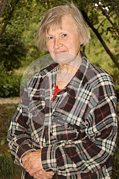 Portrait of an old woman outdoors