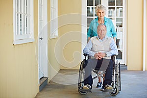 Portrait, old woman or senior man wheelchair in retirement home helping push husband for support. Happy people, mature