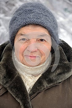 Portrait of an old woman in winter