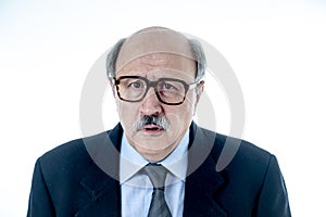 Portrait of older adult man with sad and worried expression suffering from depression