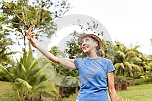 Portrait of an older woman outside his house on the warm center equator