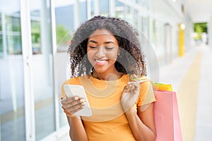 Portrait of one black woman shopping time in the street