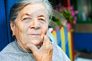 Portrait of one content old senior woman