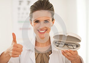 Portrait of ophthalmologist doctor woman with