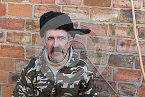 Portrait of an ordinary mustached Ukrainian peasant in fur cap