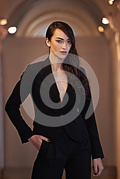 Portrait, outdoor and fashion with woman, beauty and stylish clothes with gangster, Paris and evening. Face, person or