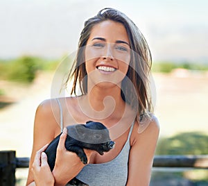 Portrait, outdoor and woman with a piglet, happy and summer with weekend break and bonding together. Face, person and