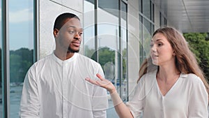 Portrait outdoors multiethnic couple african american man frustrated stressed bored guy and caucasian angry mad woman