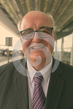Portrait of overweight senior businessman at the airport