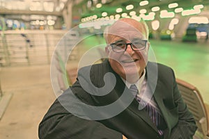 Portrait of overweight senior businessman at the airport