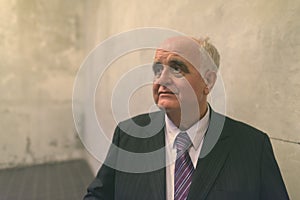 Portrait of overweight senior businessman at the airport