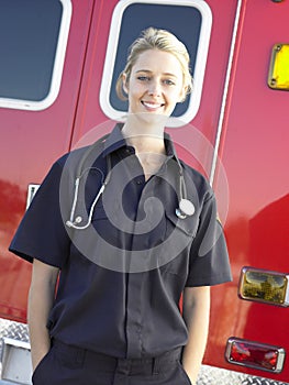 Portrait of paramedic in front of ambulance