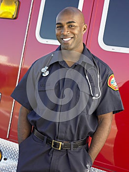 Portrait of paramedic in front of ambulance