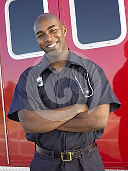 Portrait of paramedic in front of ambulance