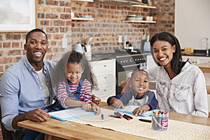 Portrait Of Parents And Children Drawing At Table