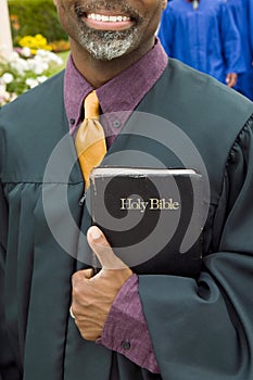 Portrait of pastor holding the bible