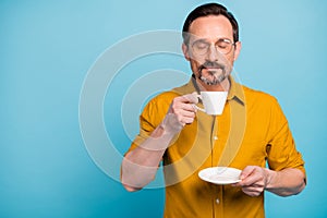 Portrait of peaceful man have work time relax hold coffee cup smell scent enjoy with closed eyes wear good look clothing