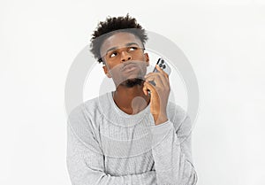 Portrait of pensive African American man with mobile phone