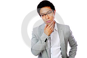Portrait of a pensive asian man in glasses