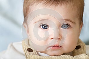 Portrait of pensive blue-eyes baby