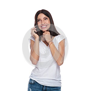 Portrait of pensive brunette girl talking on the phone