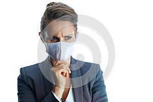 Portrait of pensive business woman in grey suit on white