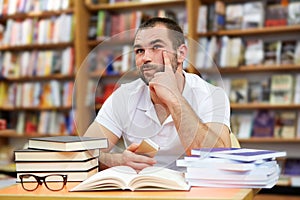 Portrait of pensive man in a bookstore