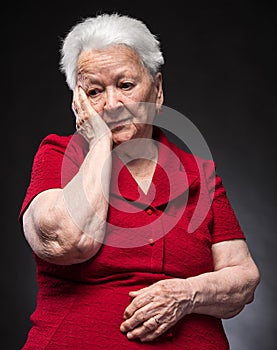 Portrait of pensive old woman