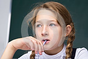 Portrait of pensive schoolgirl.Back to school, education concept