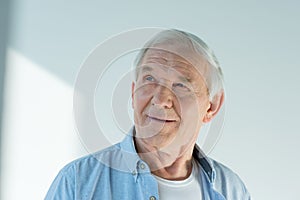 Portrait of pensive senior man in stylish shirt