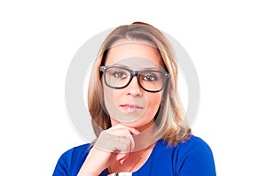 Portrait of pensive woman in glasses close-up