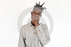 Portrait of pensive young man touching chin