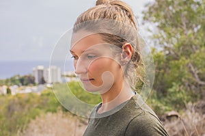 Portrait of a pensive young woman on a background of a sea landscape