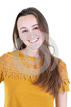 Portrait of a pensive young woman dressed in yellow shirt