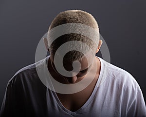 Portrait of pensive young woman with short hair on white background. Copy space