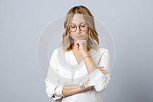 Portrait of pensive young woman standing 